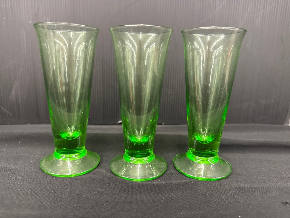 Green Glass Footed Tumblers and Stemmed Flutes