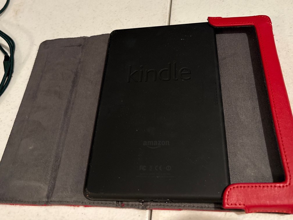 Amazon Kindle E-Reader with Red Case and Charger