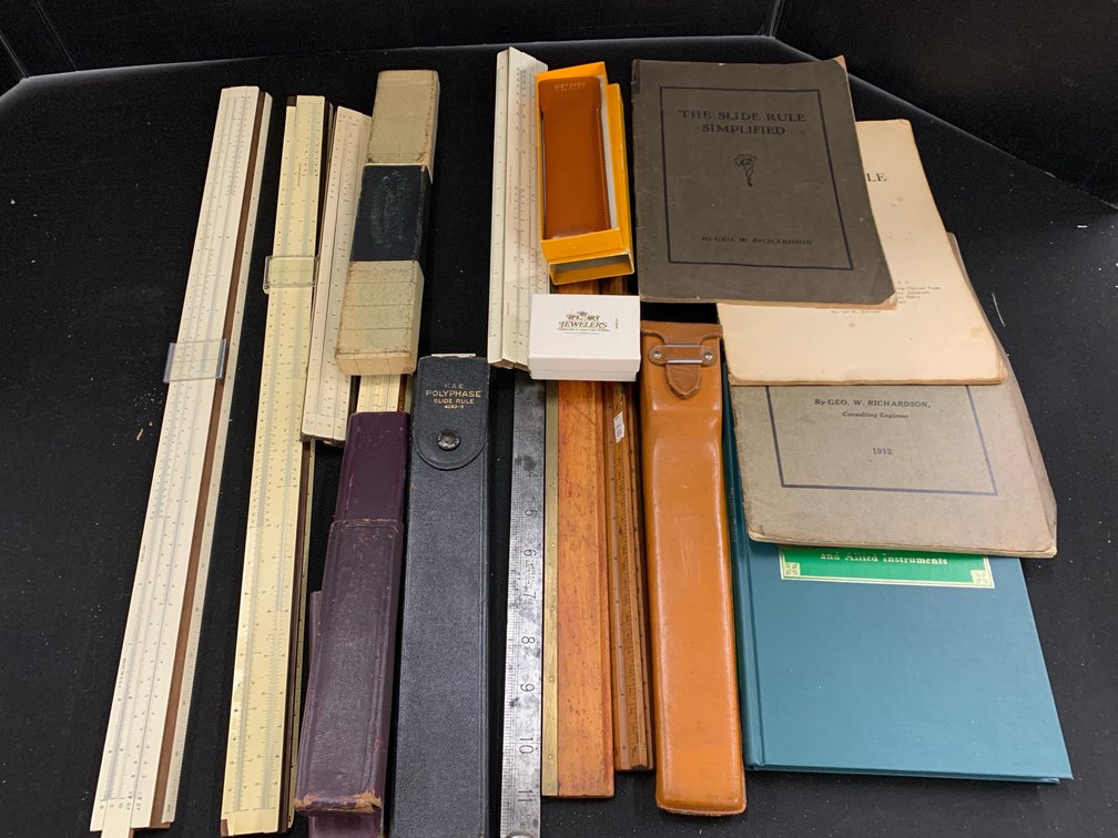 Slide Rules, Folding Rulers, Cases, and Reference Books