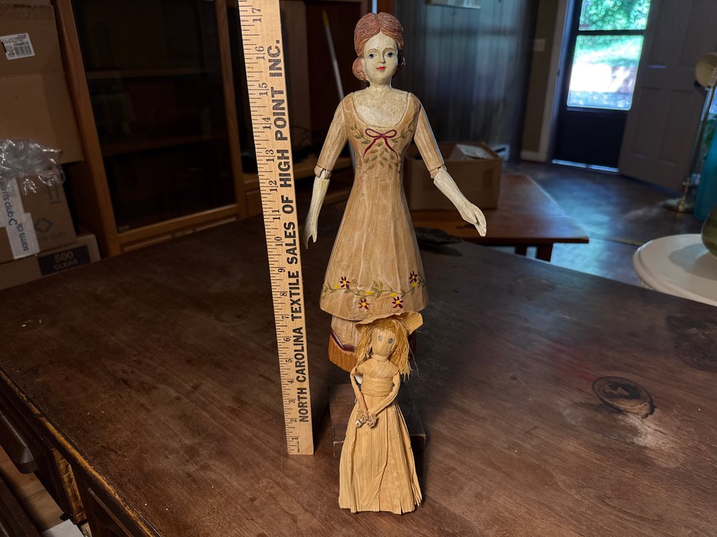 Carved Wooden Jointed Doll on Stand and Corn Husk Doll