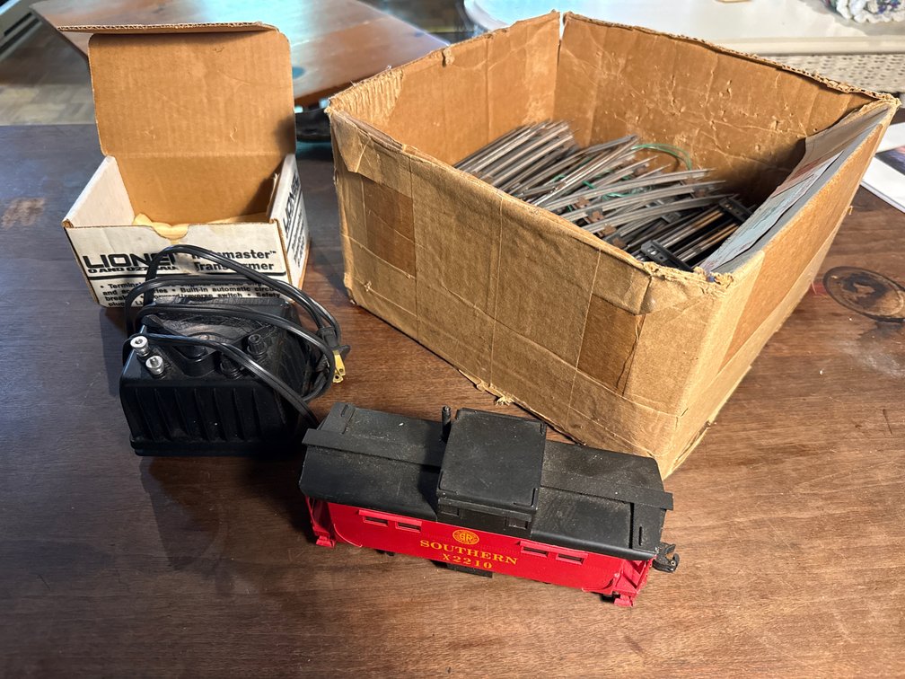 Model Train Transformer, Caboose, and 3-Rail Track
