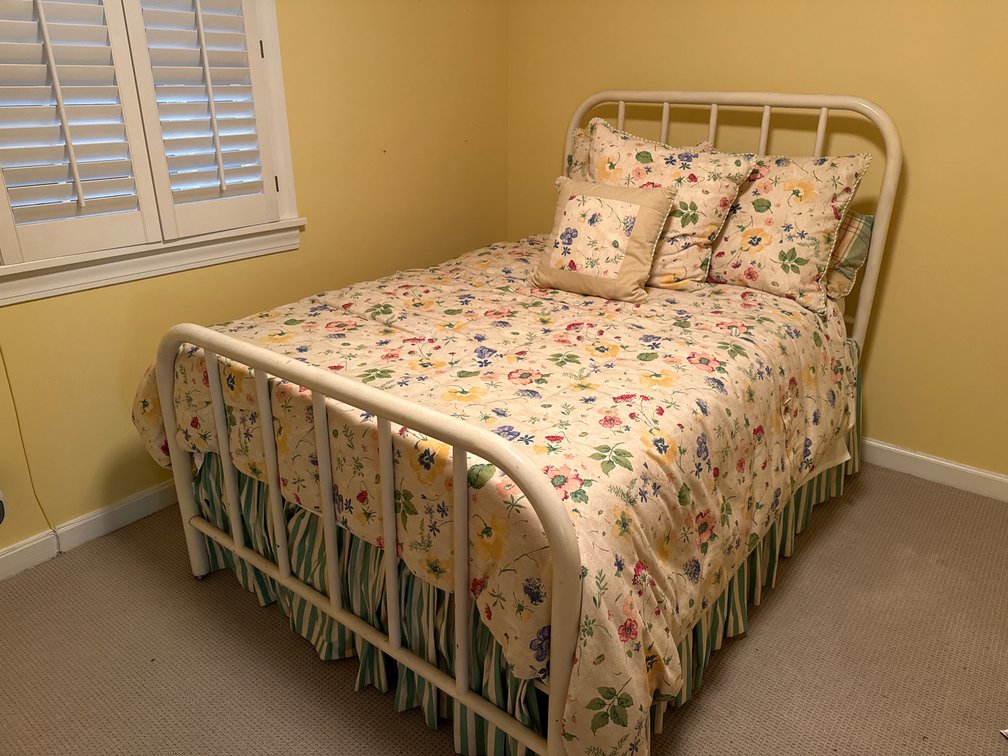 Bed Frame with Floral Bedding Ensemble