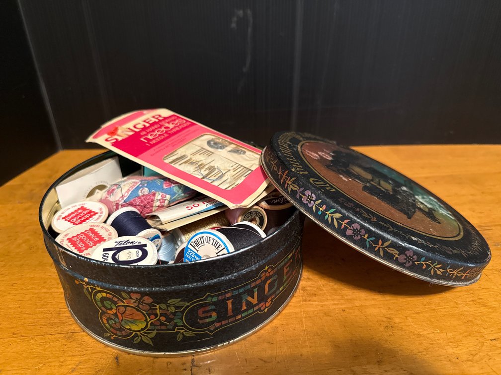 Round Metal Sewing Tin, Thread Spools, and Sewing Notions