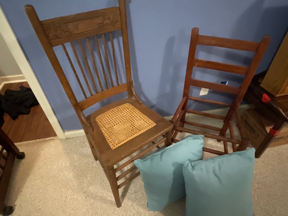 Two Wooden Chairs and Two Throw Pillows