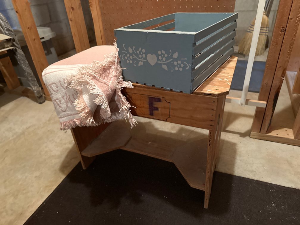 Plywood Bench, Painted Wooden Crate, and Woven Throw Blanket
