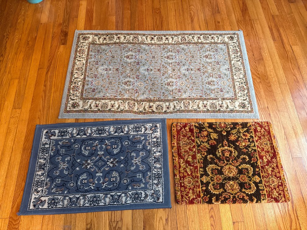 Three Rectangular Floral Patterned Accent Rugs