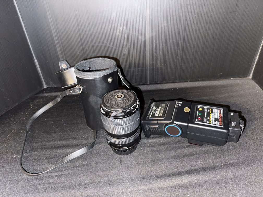 Camera Lens, Hard Lens Case, and Electronic Flash Unit