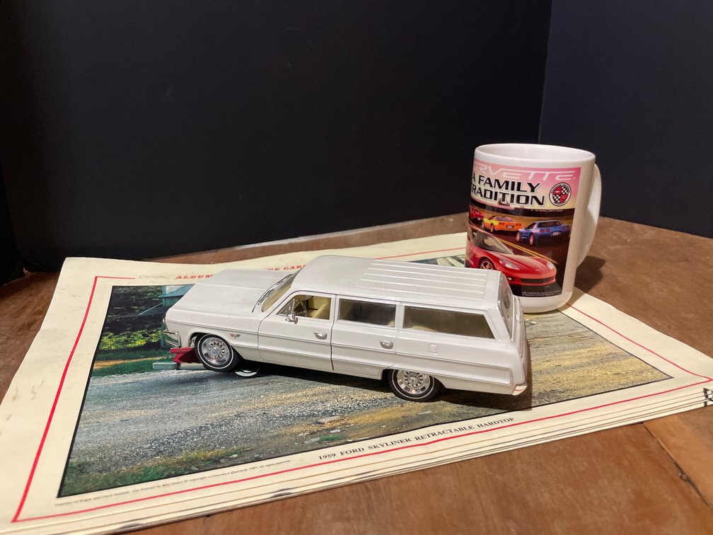 Model Station Wagon and Ceramic Mug