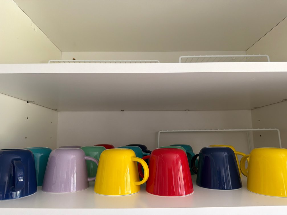 Ten Glazed Ceramic Mugs with Printed Crest Logos