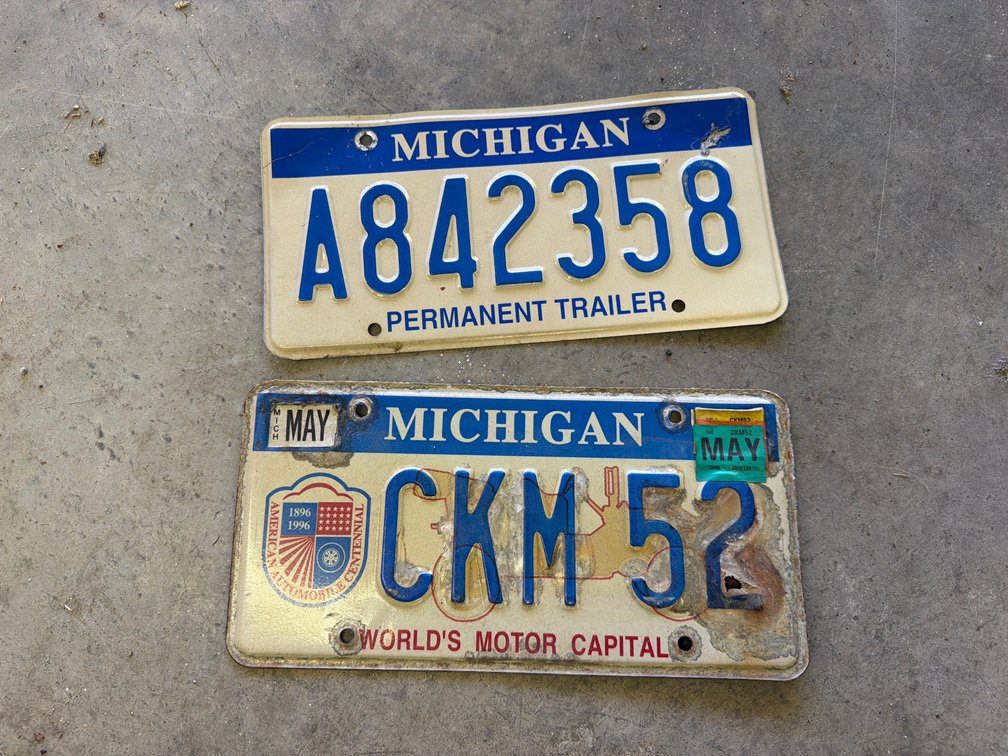 Two Michigan Stamped Metal License Plates