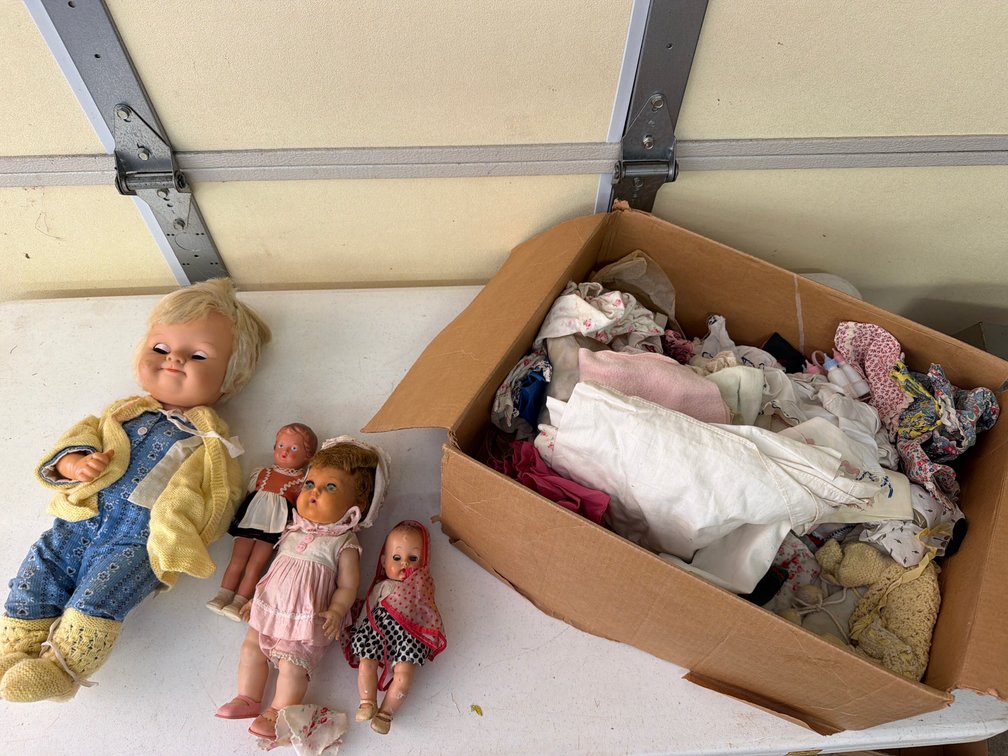 Four Dolls with Doll Clothes and Accessories