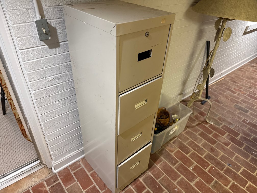 Four-Drawer Metal Filing Cabinet and Storage Tote with Contents