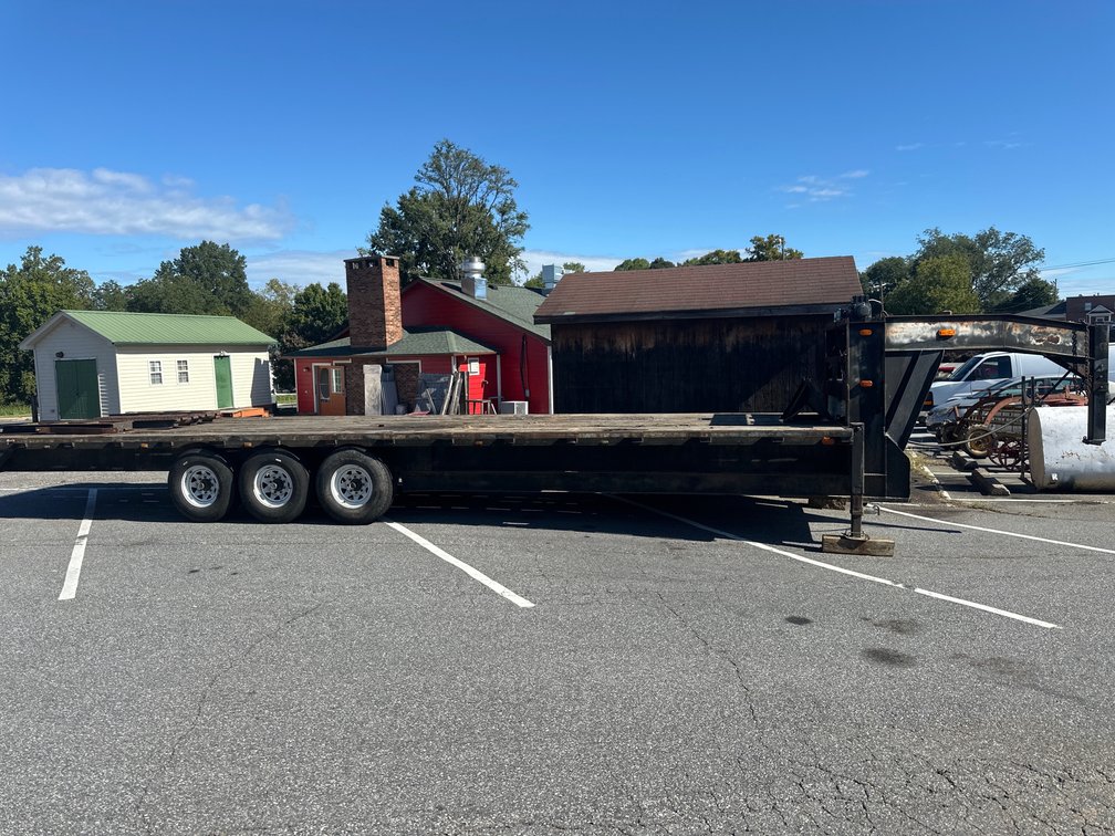 Triple-Axle Gooseneck Flatbed Equipment Trailer with Toolboxes