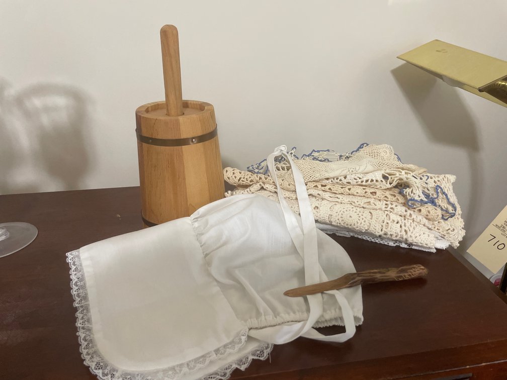 Wooden Butter Churn, Bonnet, Crocheted Linens, and Spreader
