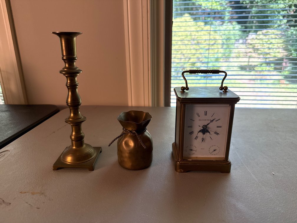 Brass Carriage Clock, Candlestick, and Vessel