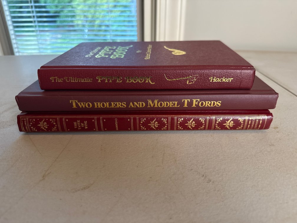 Burgundy Hardcover Books on Wine, Pipes, and Model T Fords