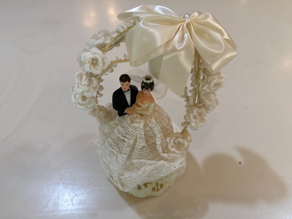 Bride and groom wedding cake topper