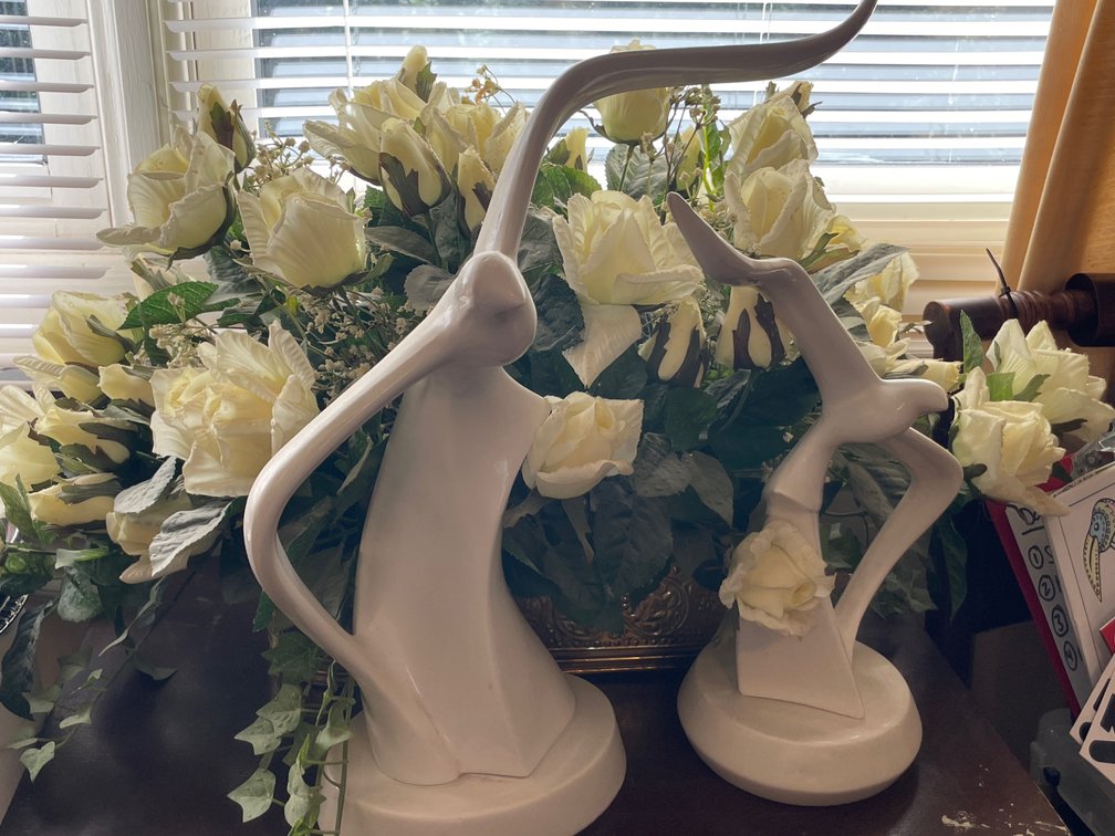 Ceramic Bird Sculptures and Artificial Floral Arrangement