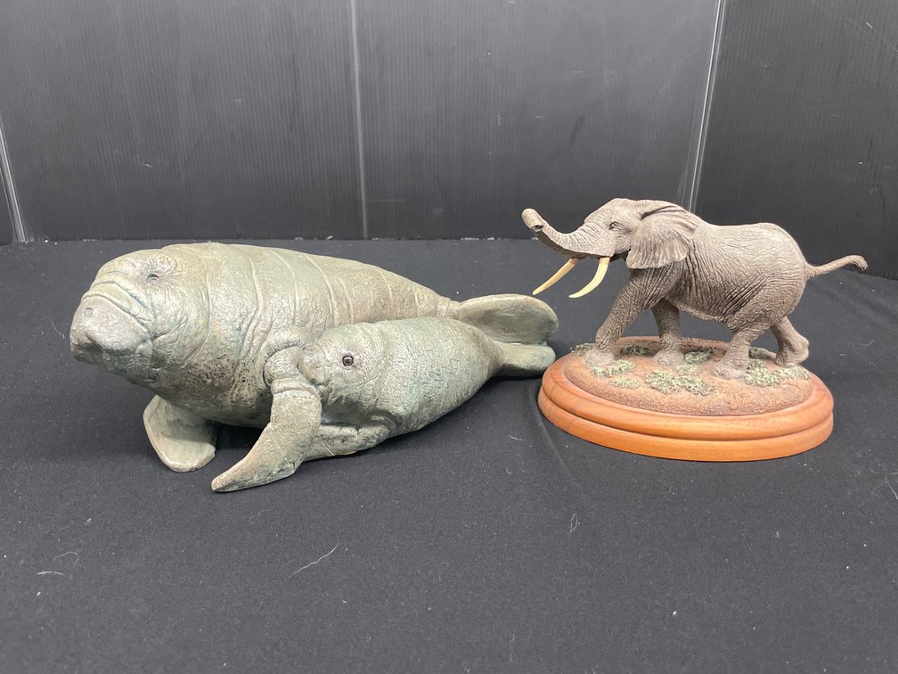 Neal Deaton Elephant and United Design Manatee Figurines