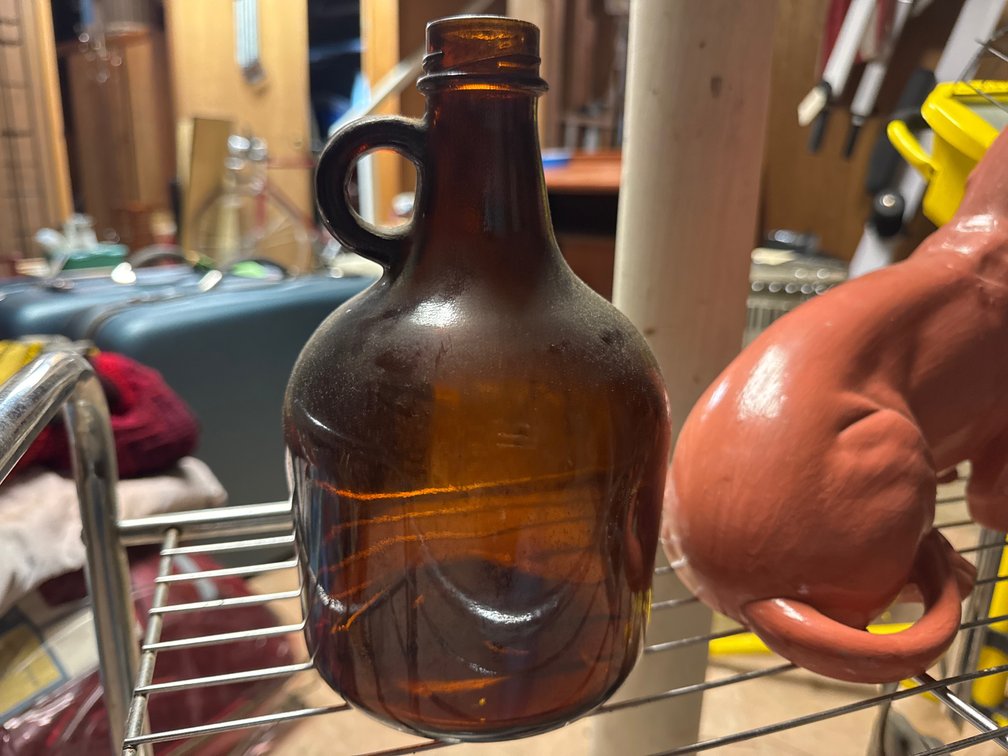 Two-Tier Wire Stand, Amber Glass Jug, Model Car