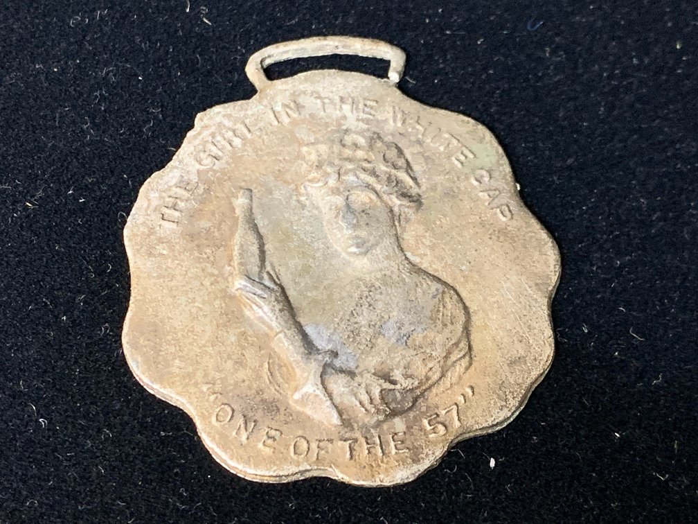 Heinz The Girl in the White Cap Metal Watch Fob Medal