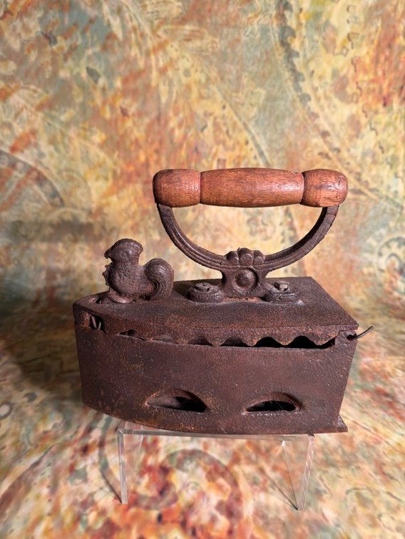 antique cast-iron charcoal clothes iron with wooden handle