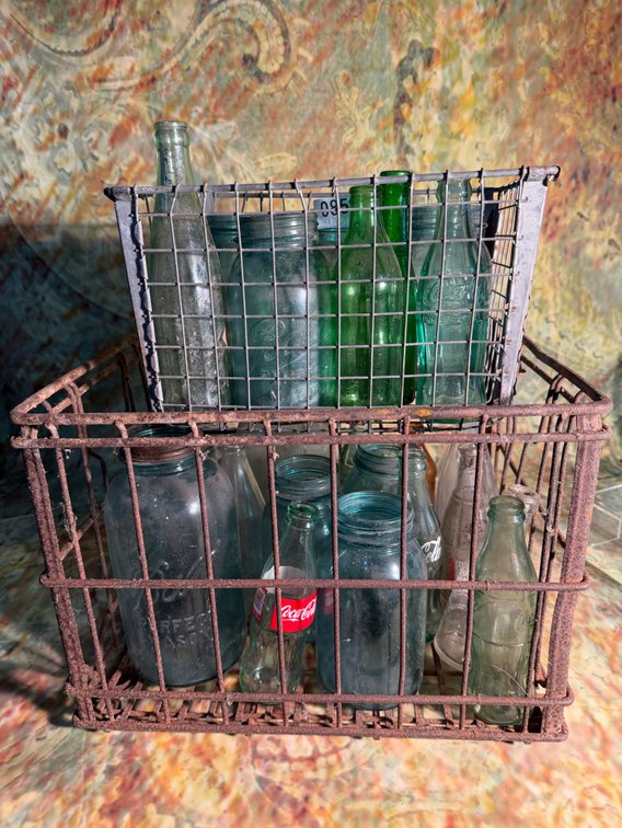 Vintage metal crates with bottles and jars
