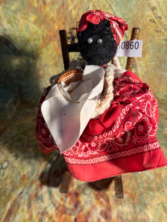 Americana doll in wooden rocker