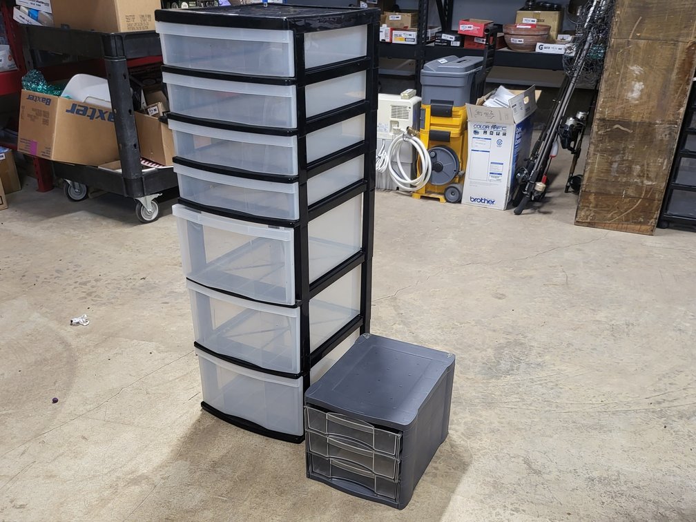 Plastic drawers 3 large And 4 Small Approx 40 Inches Tall By 13 Wide By 15 Deep