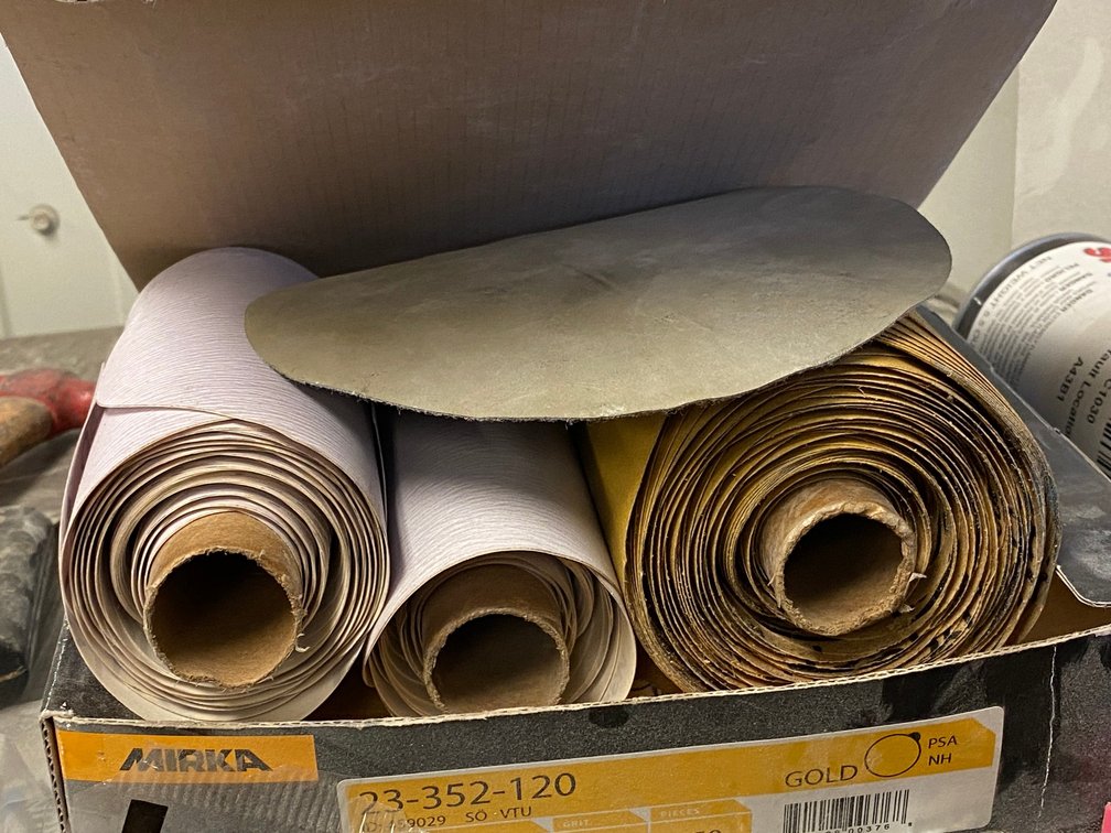Contents of storage unit:  Rolls of sandpaper, extension cord, misc.
