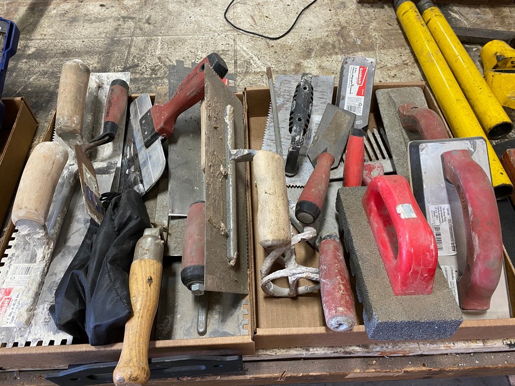 2 Flats of masonry or tile tools
