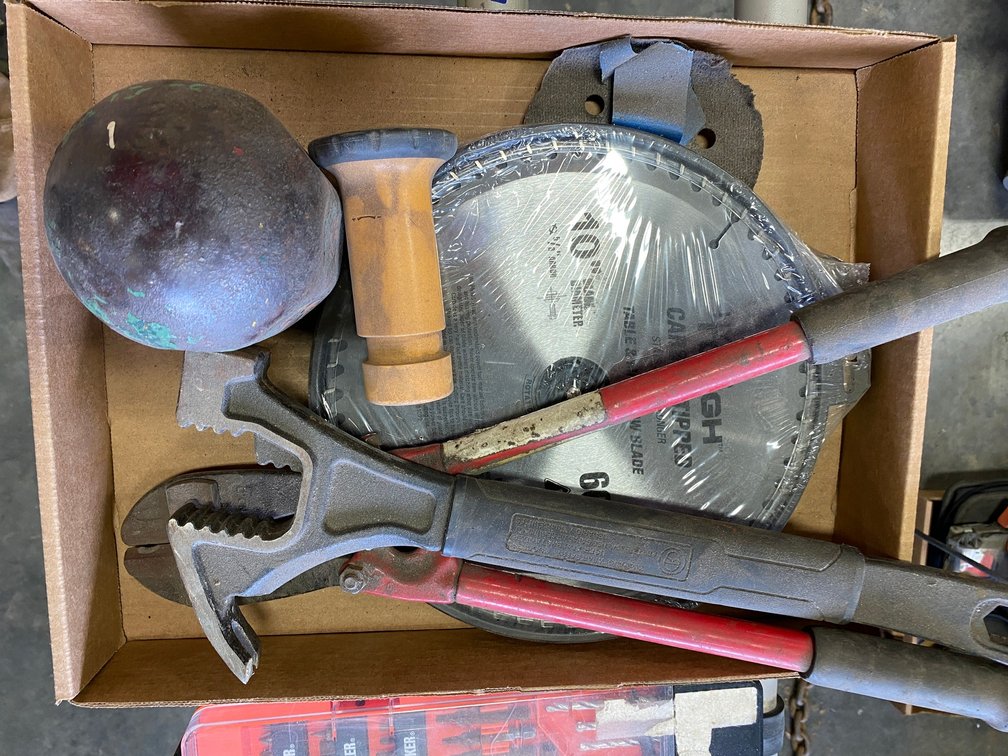 Box w/ bolt cutter, some saw blades and some misc. items, sockets and screwdriver tips