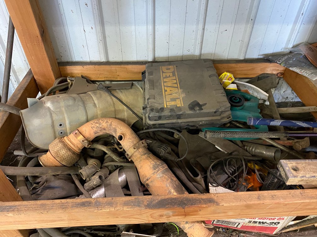 Scrap and all the contents underneath the bench