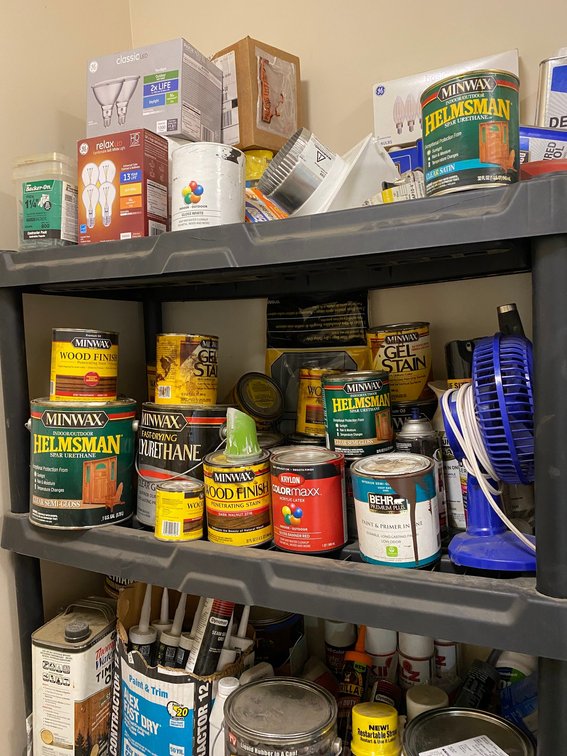 Shelf and contents:  Tubes of silicone, paint, other supplies