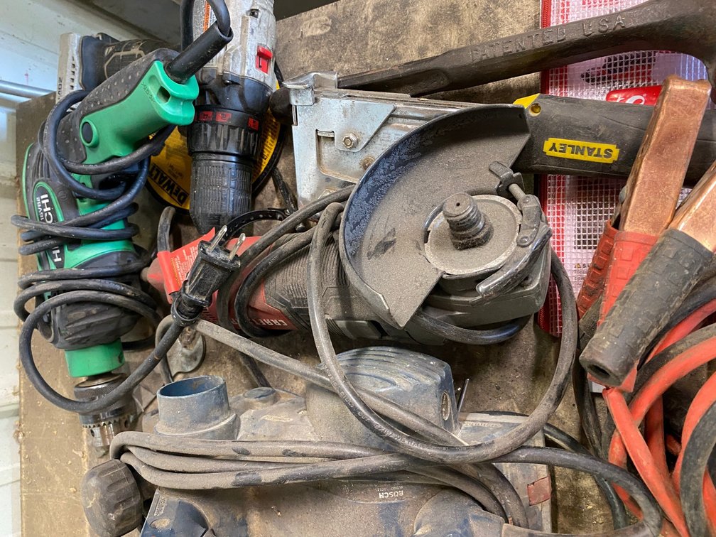 Jumper cables, Hitachi electric drill, Craftsman angle grinder and Bosch portable planer