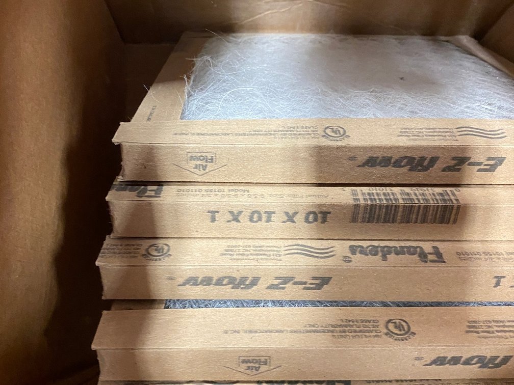 Plastic base for a washer (catches leaks) and box of 12x12x1" furnace air filters