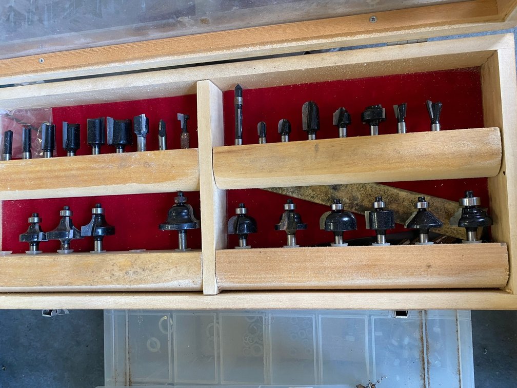 Several boxes of router bits