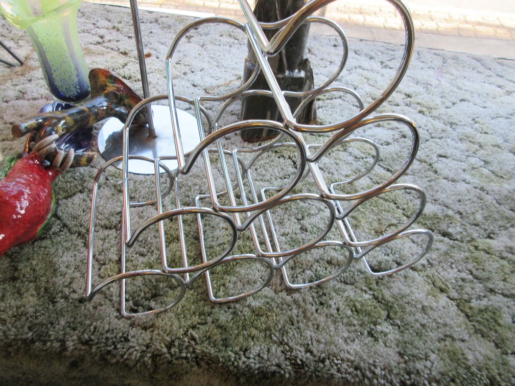 Table lamp from 50's, old telephone, some artwork and wine rack