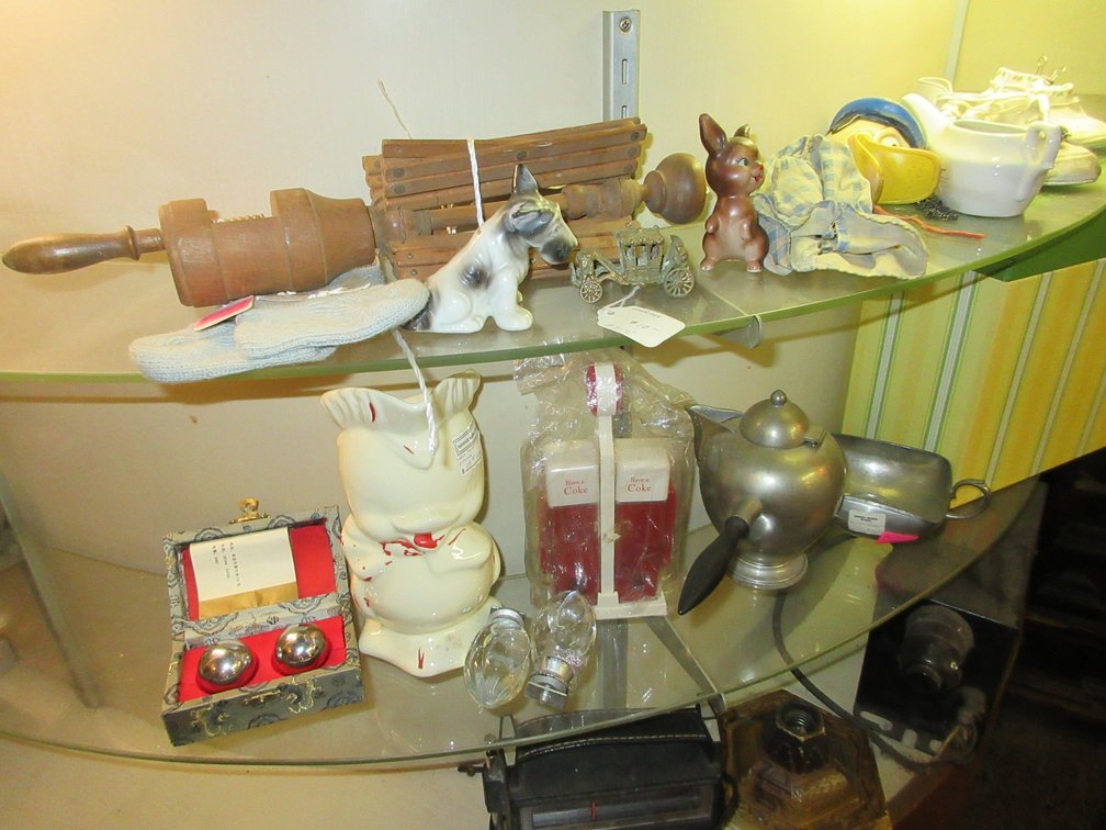 3 Shelves on the counter:  Baby shoes, wooden items, some vases, radios, misc.