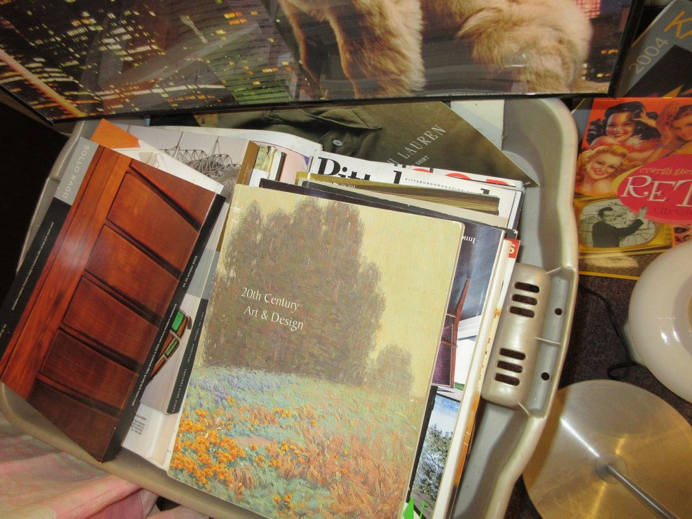 Tote of assorted books and magazines, Spiro Agnew small trash can, some retro calendars from 2001 and a floor light, poster of Puppy Power
