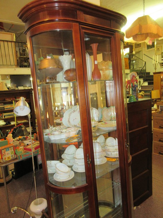 This is a lighted curved glass PULASKI china cabinet (label is on back)