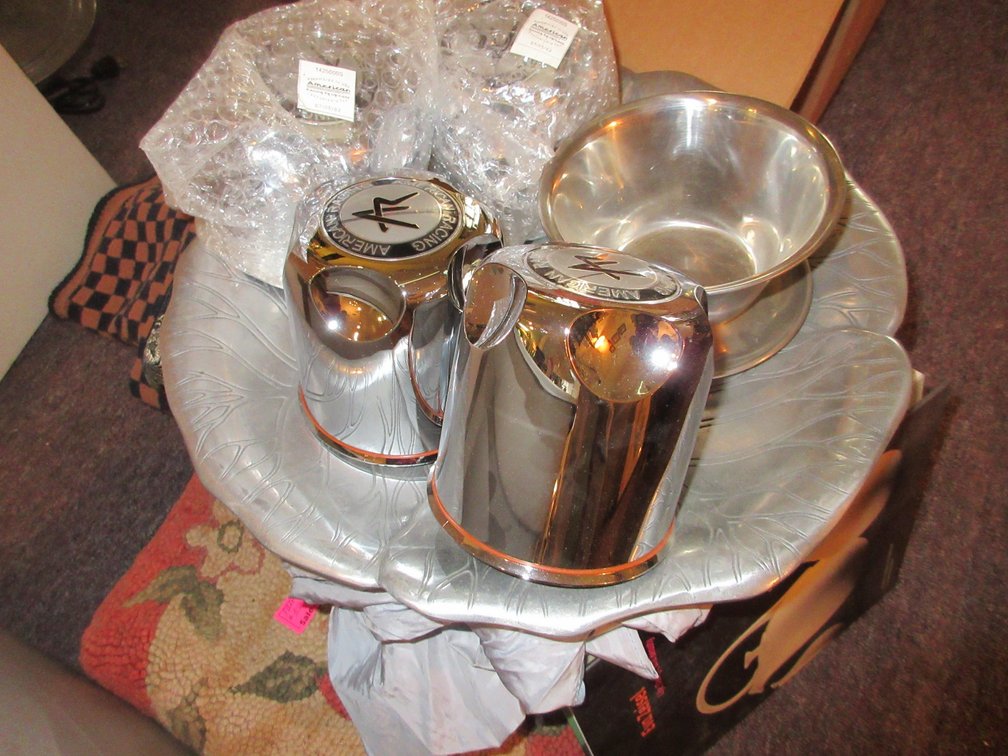 Contents of tote:  Glass candlesticks, some books, tapestry, dry goods