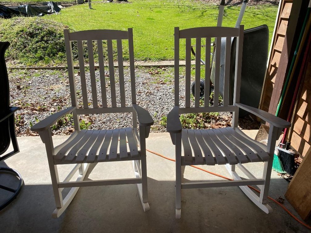 2 White patio rocking chairs