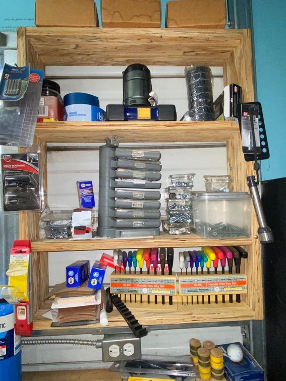 Contents of back of bench:  Nuts and screw organizer, T-handle hex 10-piece set and other items