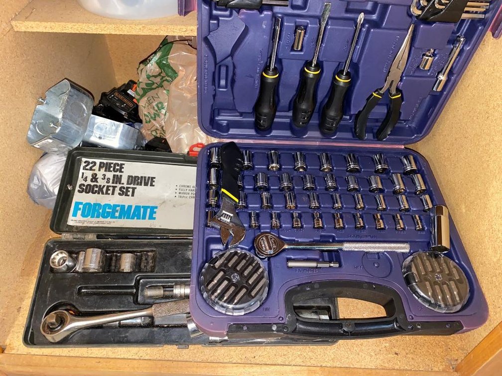 Contents of cabinet:  94-Piece garage tool set, electrical supplies, screws, nails, other items