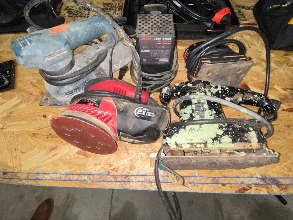 Group of sanders:  Craftsman palm sander, Black & Decker sander, Skil sander