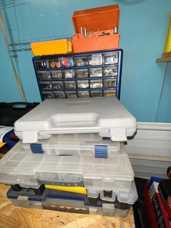 Group of bolts, nuts, screws, electrical connections and bolt organizers w/ other storage boxes