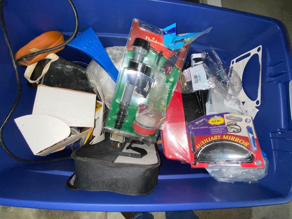 Tote of painting and plumbing supplies