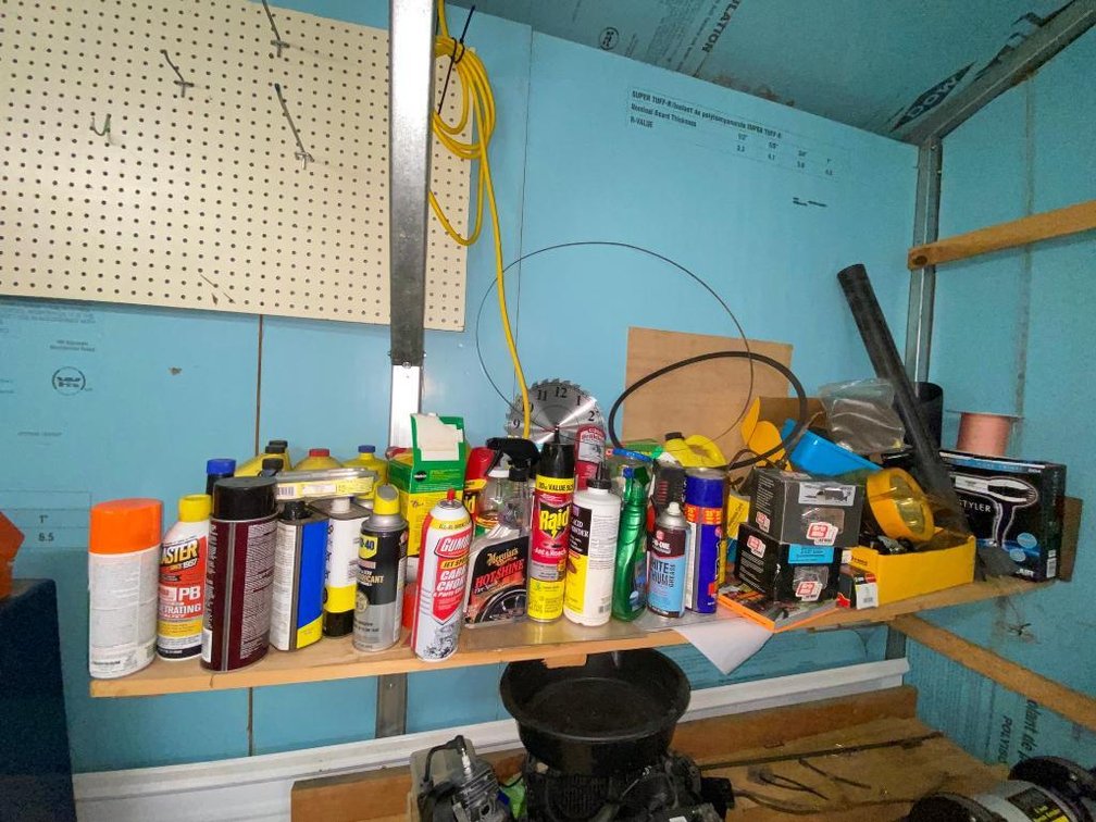 Contents of shelf:  Automotive goods, PB blaster, screws, nails, clock, blow dryer, light, waxes, Raid Ant and Roach, Miracle Gro, anti-freezer, oilers, other items