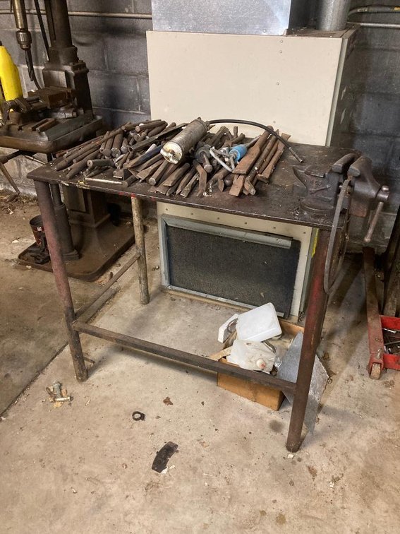 Metal welder's table w/ contents:  Chisels, small vise